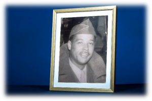 This is photo of a man in military uniform and hat.