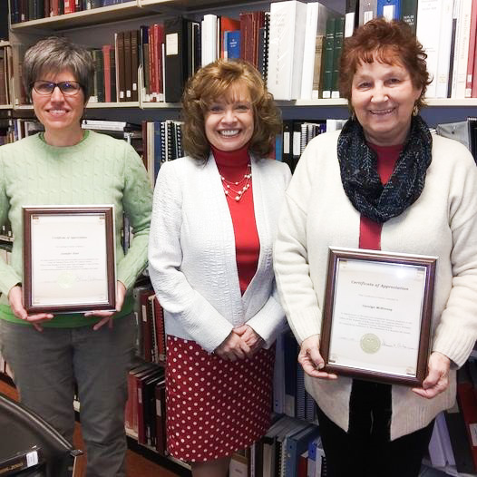 This is a photo of Archivist Jennifer Hurl; center, Register of Wills Sharon Ackerman; right,  and Archives Assistant Carolyn McKinney with awards.